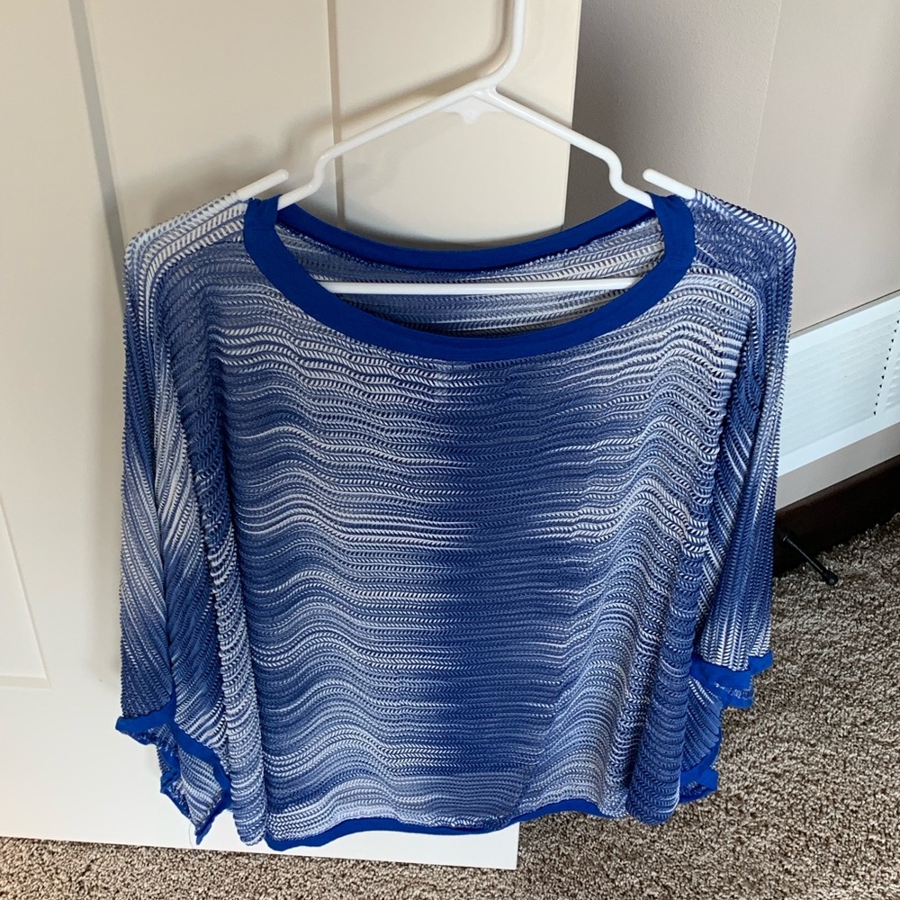 Lightweight royal blue and white sweater.